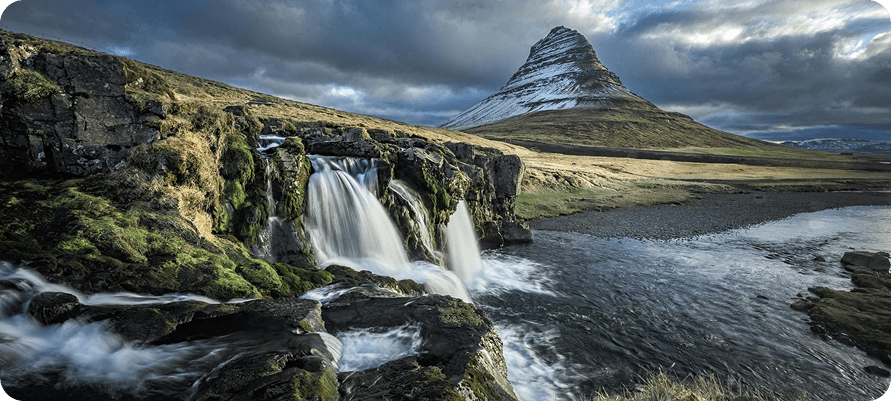 Iceland waterfall and mountain landscape
